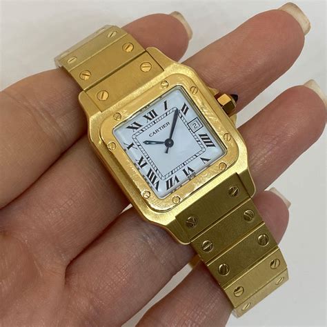 18 karat gold cartier watch.